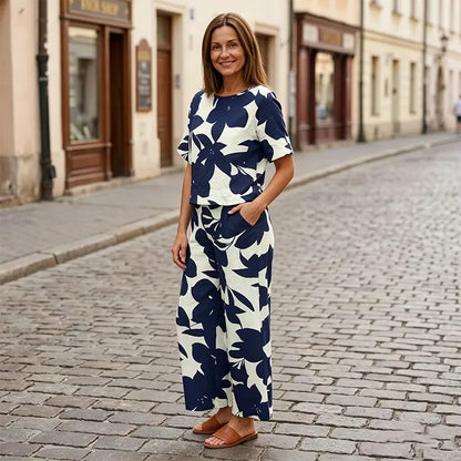 🌸 Dámský letní set – tričko s krátkým rukávem + široké kalhoty, moderní květinový motiv 🌿 Pohodlné, stylové a ideální na léto! ✨