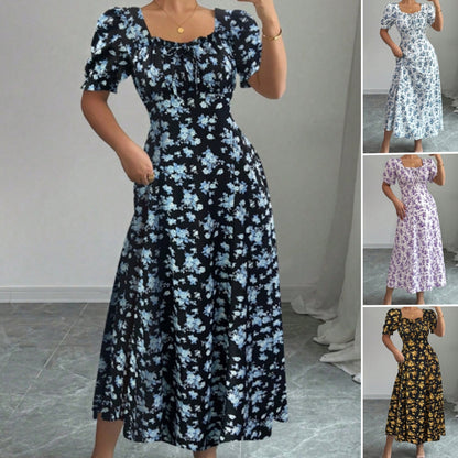 👗Poslední den akce -50%! 【S-2XL】Elegantní letní šaty s květinovým potiskem, vzdušné a pohodlné, snadno se stylizují, zeštíhlují postavu.