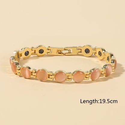 Elegancka bransoletka magnetyczna ze złotym kamieniem Cat Eye